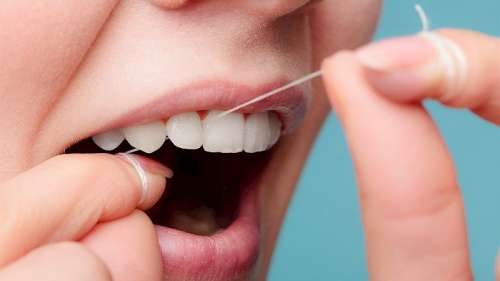 فواید استفاده از نخ دندان | اهمیت نخ دندان کشیدن برای پیشیگری از پوسیدگی